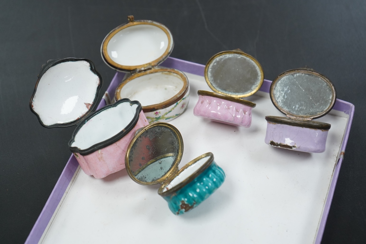 Five late 18th and 19th century enamel South Staffordshire patch boxes, largest 5.5cm wide